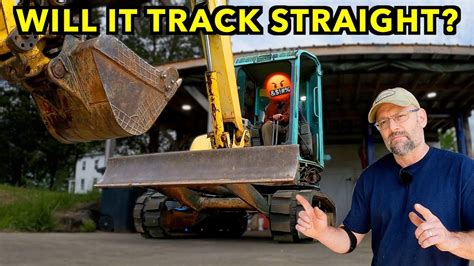 mini digger not tracking straight|excavators not tracking straight repair.